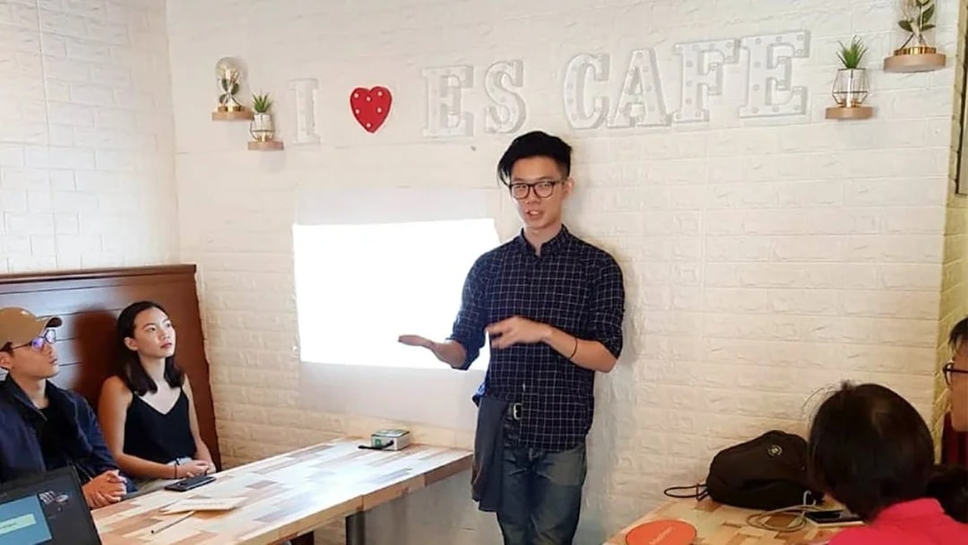 Coffee workshop presentation at Nineteen95 Espresso Bar with attendees listening attentively.