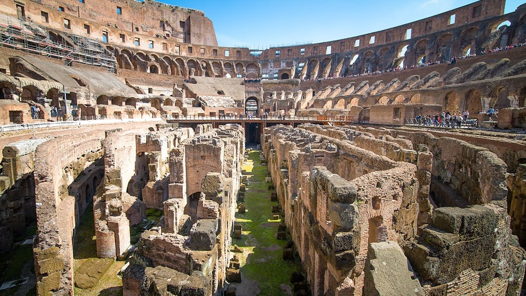 Colosseum underground ruins with ancient stone structures in Rome, Italy.