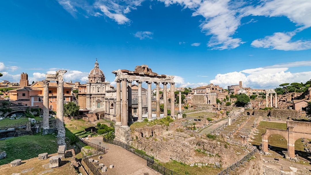 Tourists exploring ruins of Palatine Hill and Roman Forum, Rome, Italy.