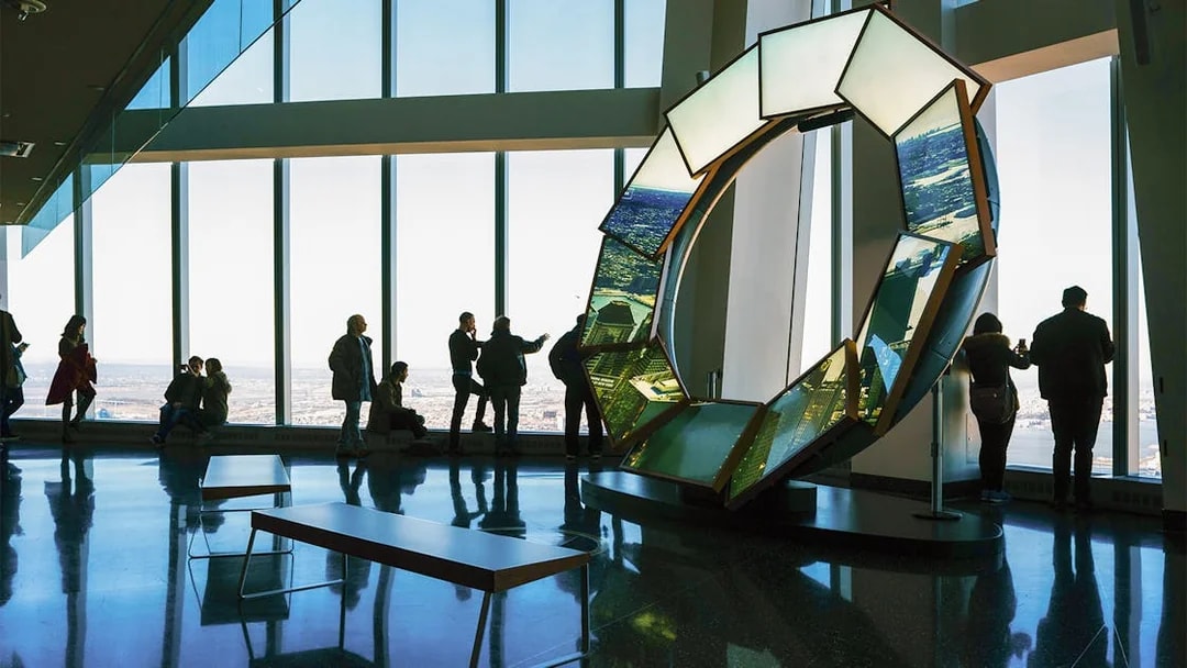 Visitors enjoying panoramic views at One World Observatory, New York City.
