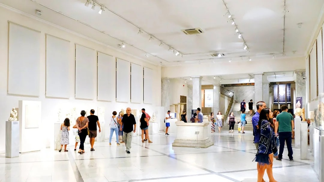 Visitors exploring exhibits at Athens National Archaeological Museum.
