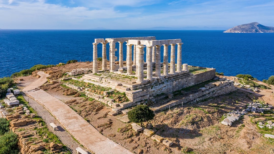 Temple of Poseidon at Cape Sounion overlooking the Aegean Sea.
