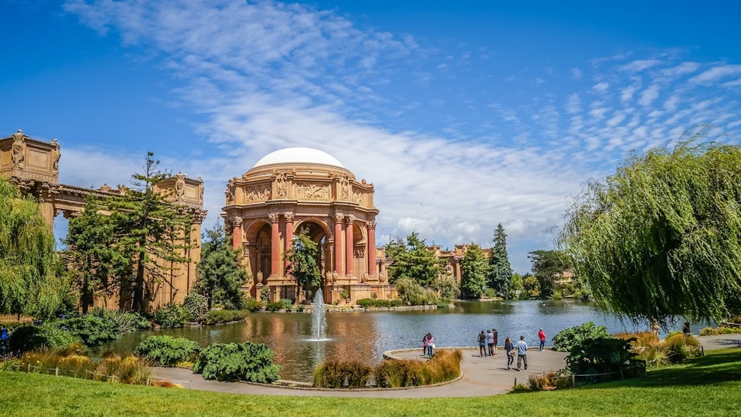 Palace of Fine Arts in San Francisco with people by the lagoon.