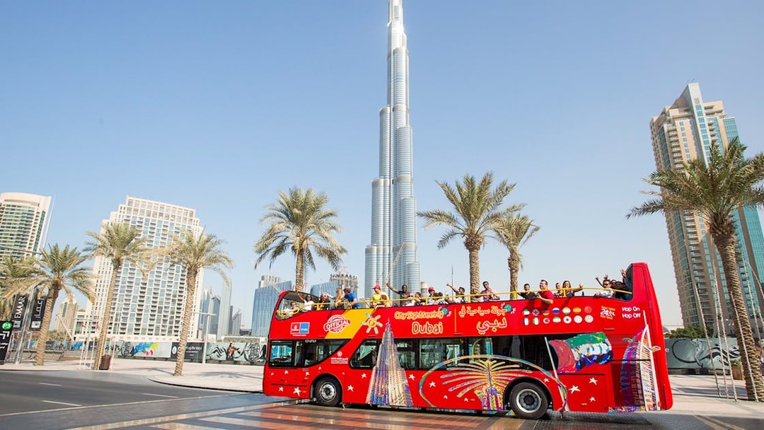 Citysightseeing Dubai bus in front of Burj Khalifa.