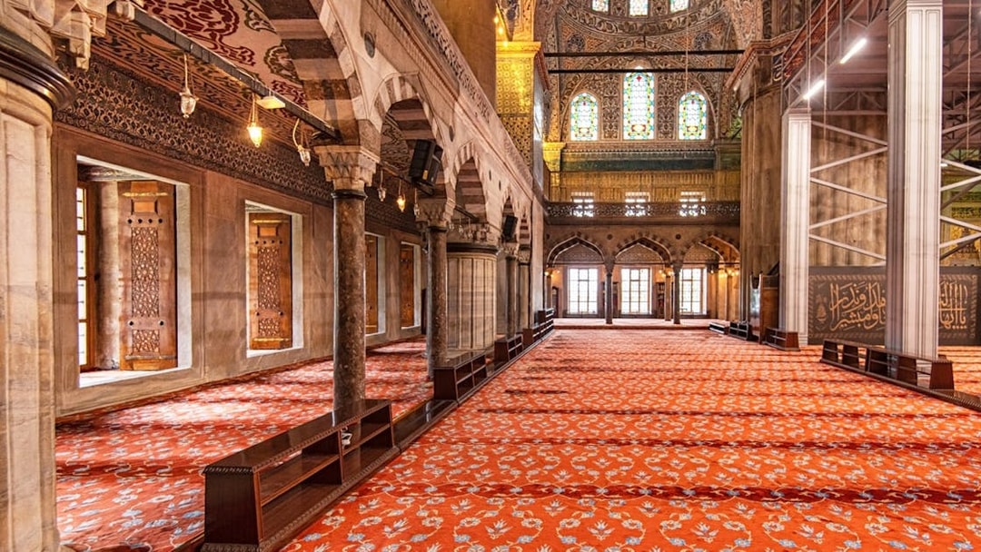 Royal Kiosk interior with ornate columns and stained glass in the Blue Mosque, Istanbul.