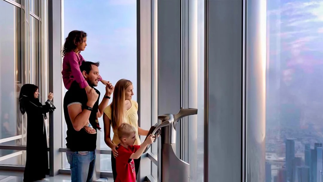 Visitors enjoying the view from Burj Khalifa observation deck, Dubai.