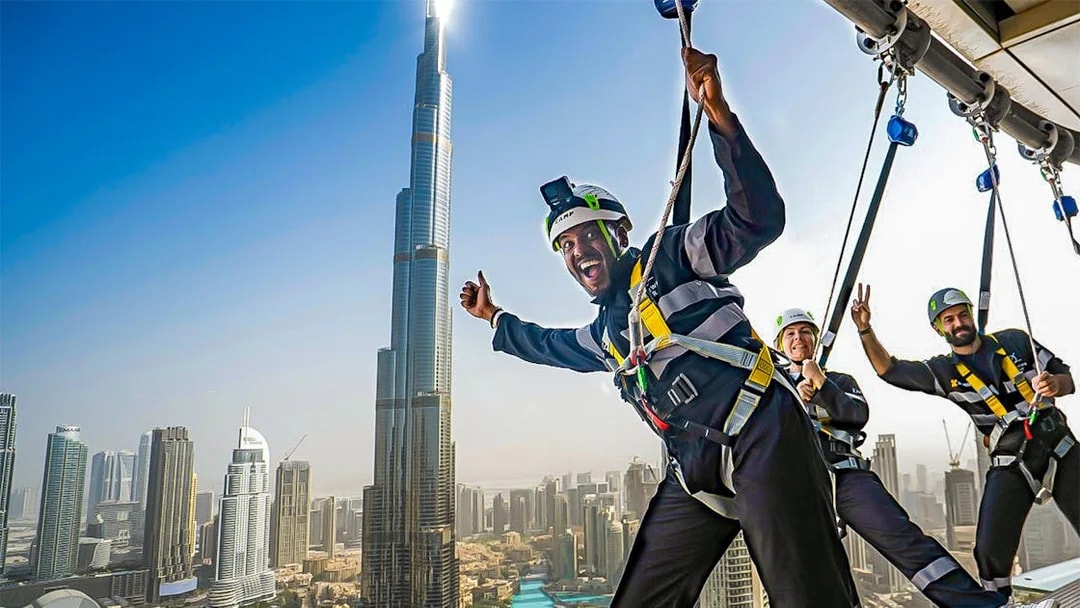 Visitors enjoying the Sky Views experience with Burj Khalifa in the background, Dubai.