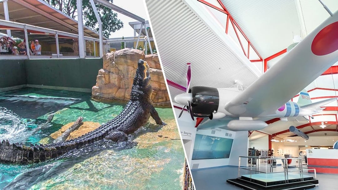 Crocodile in water at Crocosaurus Cove, Darwin, and a historic aircraft display indoors.