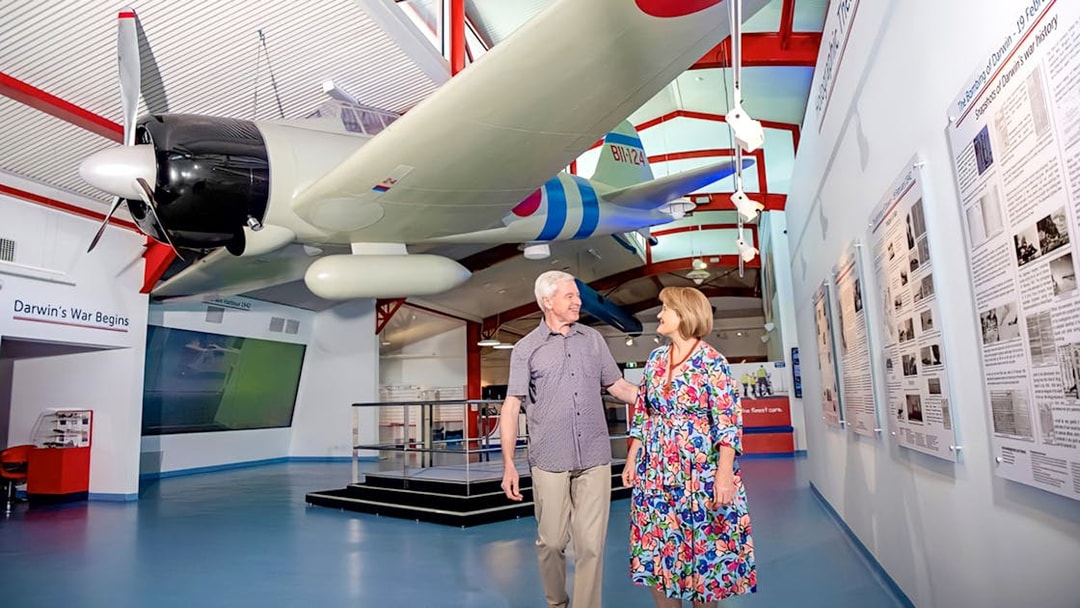 Airplane exhibit at Royal Flying Doctor Service in Darwin with visitors exploring the museum.