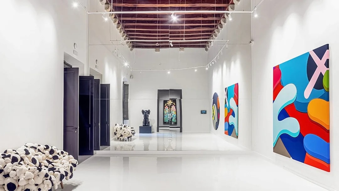 KAWS artwork displayed at Moco Museum in Barcelona gallery.