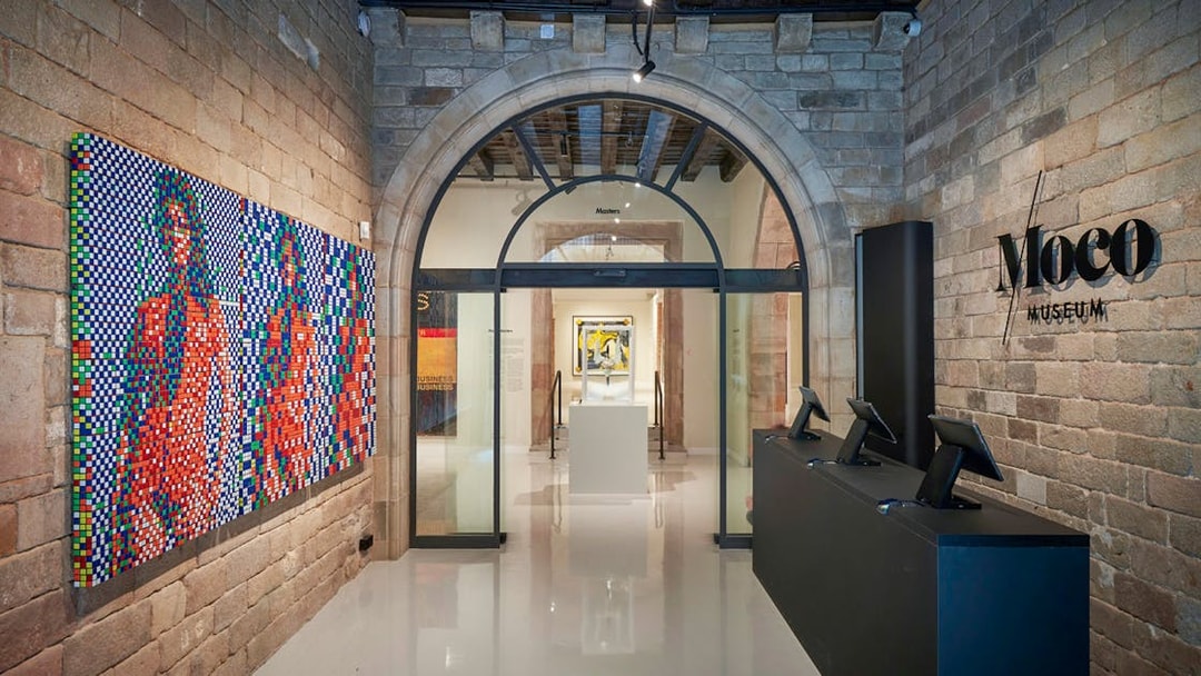 Moco Museum entrance with colorful artwork in Barcelona, Spain.