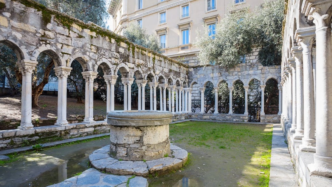 Courtyard with stone arches at Casa di Colombo, Genoa, Italy.
