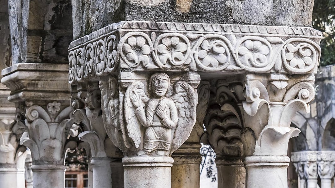 Stone column with intricate carvings at Casa di Colombo, Genoa.