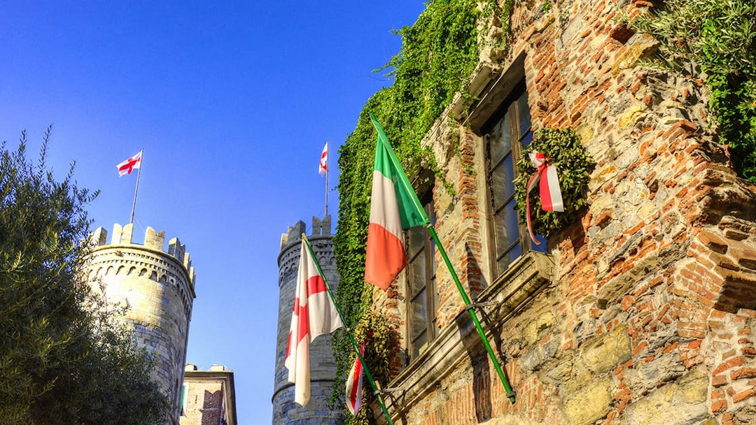 Casa di Colombo with Italian and Genoese flags, Genoa, Italy.