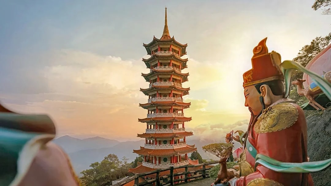 Genting Highlands pagoda and statue at sunset, Malaysia.