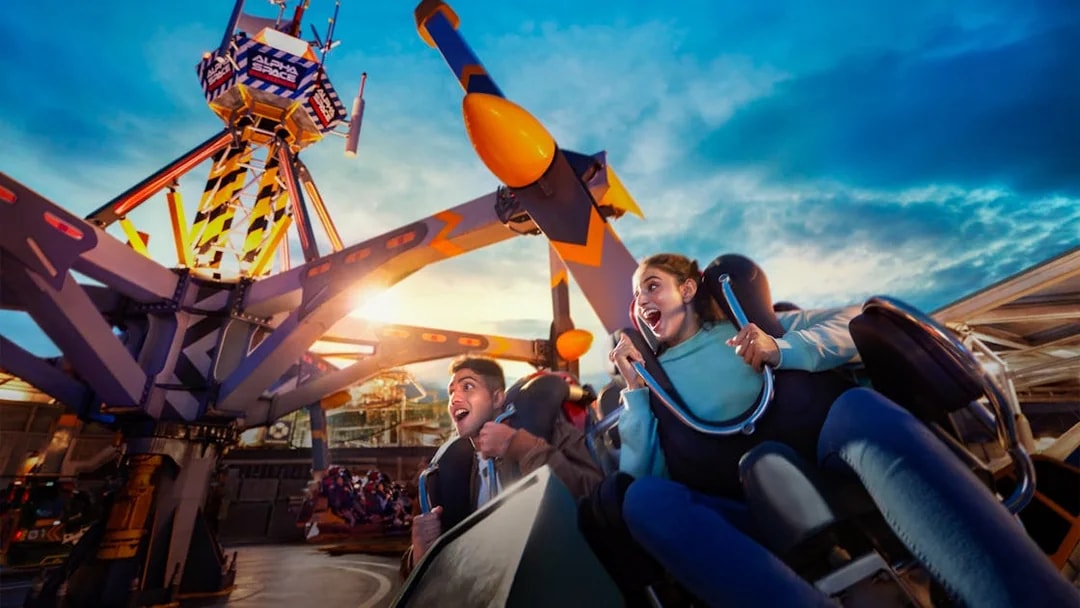 Visitors enjoying a thrilling ride at Skytropolis Theme Park.