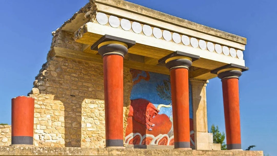 Knossos Palace ruins with red columns and fresco in Heraklion, Crete.