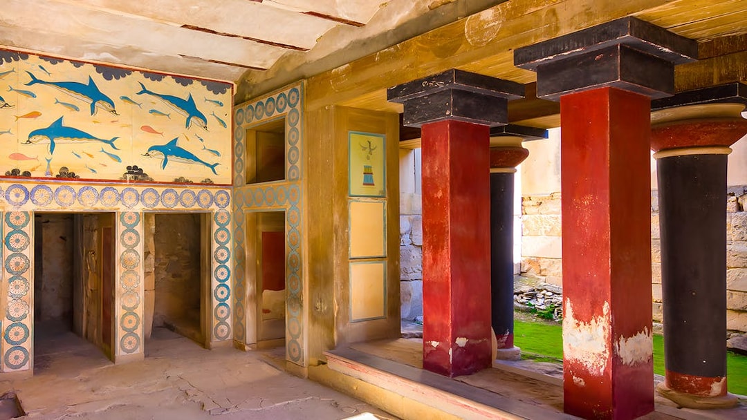 Knossos Palace interior with frescoes and red columns, Crete.