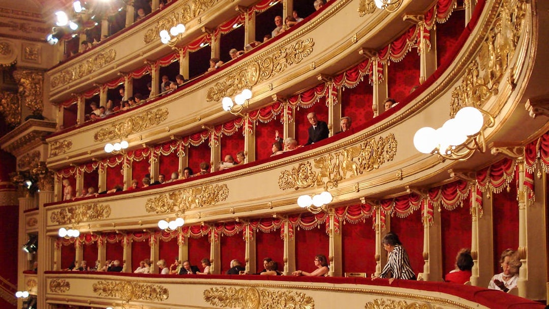 La Scala Theater balconies with ornate gold details during skip-the-line guided tour.