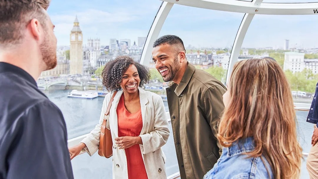 Group enjoying view of Big Ben from London Eye capsule.
