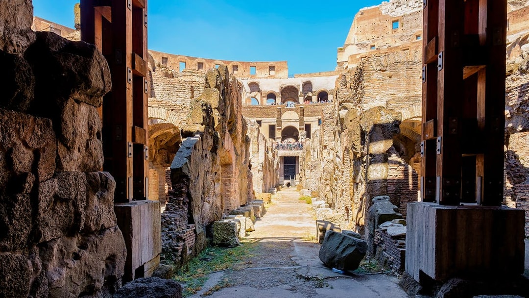 Colosseum underground passageway with ancient stone walls in Rome, Italy.