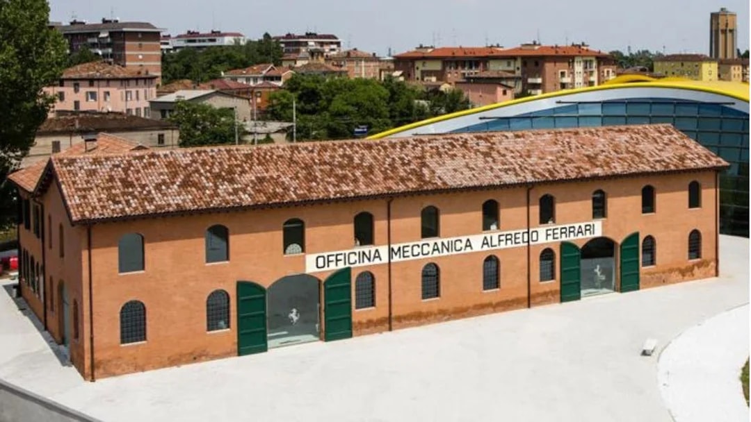 Maranello Ferrari Museum building exterior with "Officina Meccanica Alfredo Ferrari" sign.