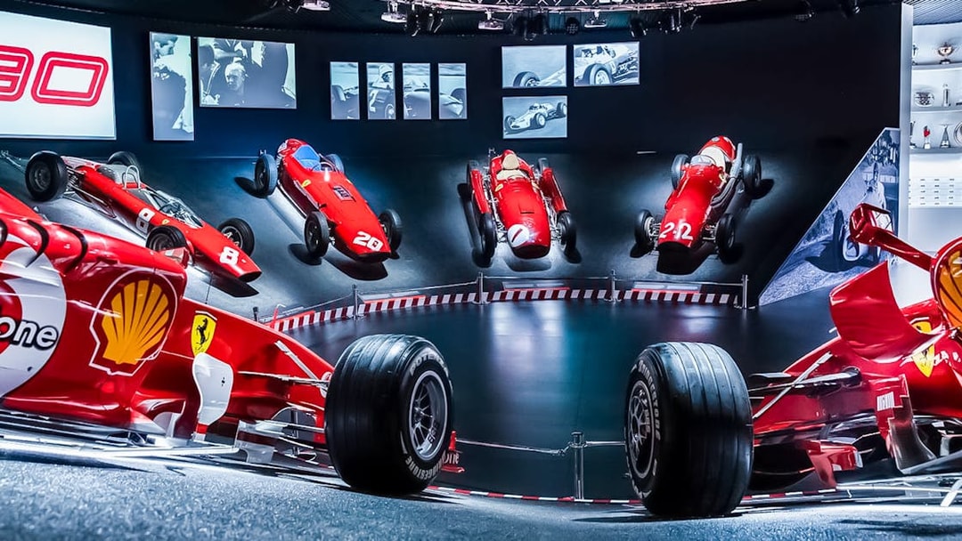 Ferrari race cars displayed at Maranello Ferrari Museum, part of the Modena Enzo Ferrari Museum combo ticket.