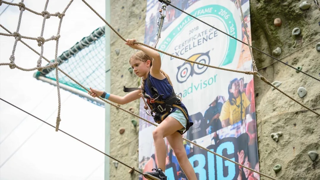 Child navigating a rope course at Mega Adventure Park, Singapore.