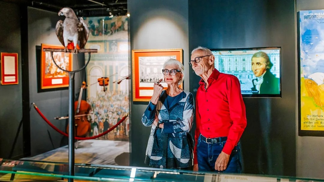 Guests observing exhibits inside Haus der Musik, Vienna.