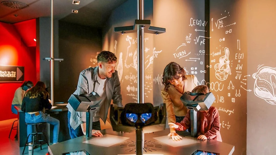 Guests interacting with exhibits inside Haus der Musik, Vienna.