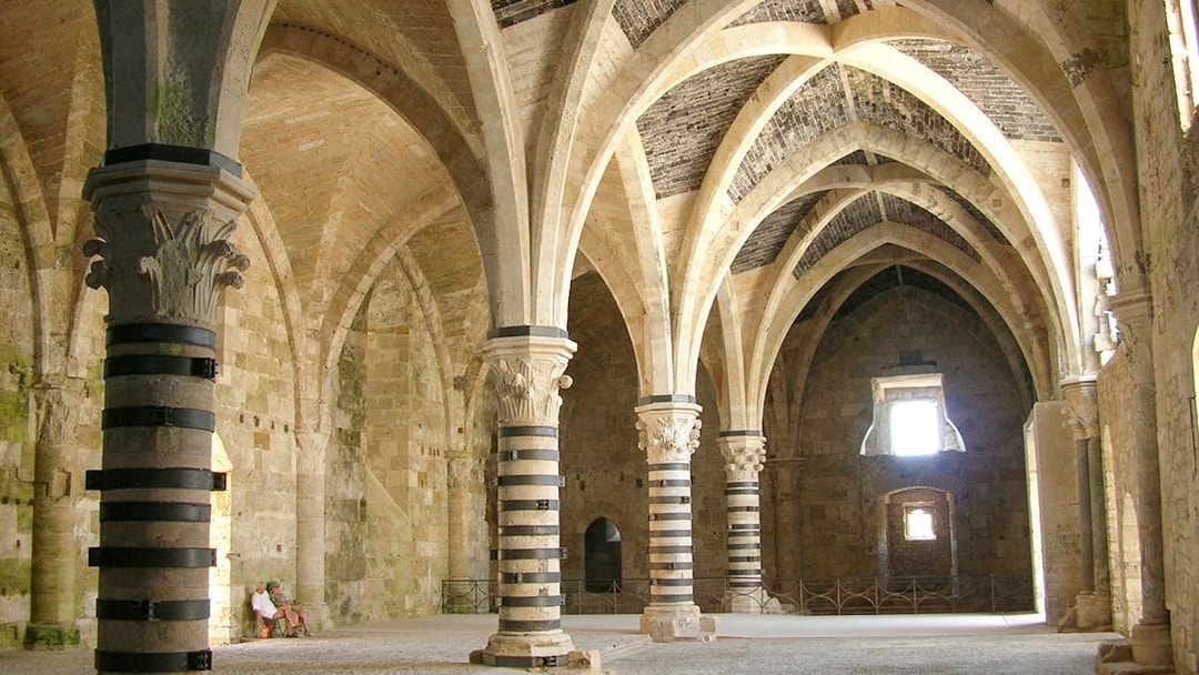 Interior arches and columns of Maniace Castle in Syracuse, Italy.