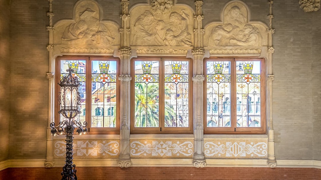 Stained glass windows and ornate carvings at Sant Pau Art Nouveau site, Barcelona.