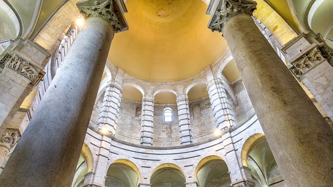 Pillars and arches inside the Pisa Baptistery, Italy.