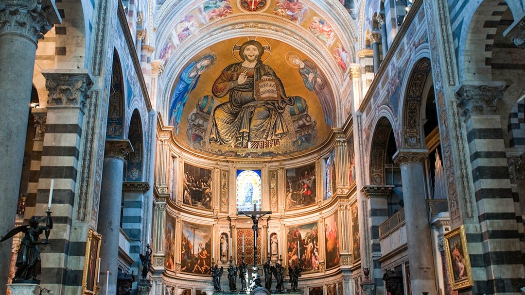 Interior of Pisa Cathedral with ornate frescoes and arches, part of the Small-Group Guided Tour.