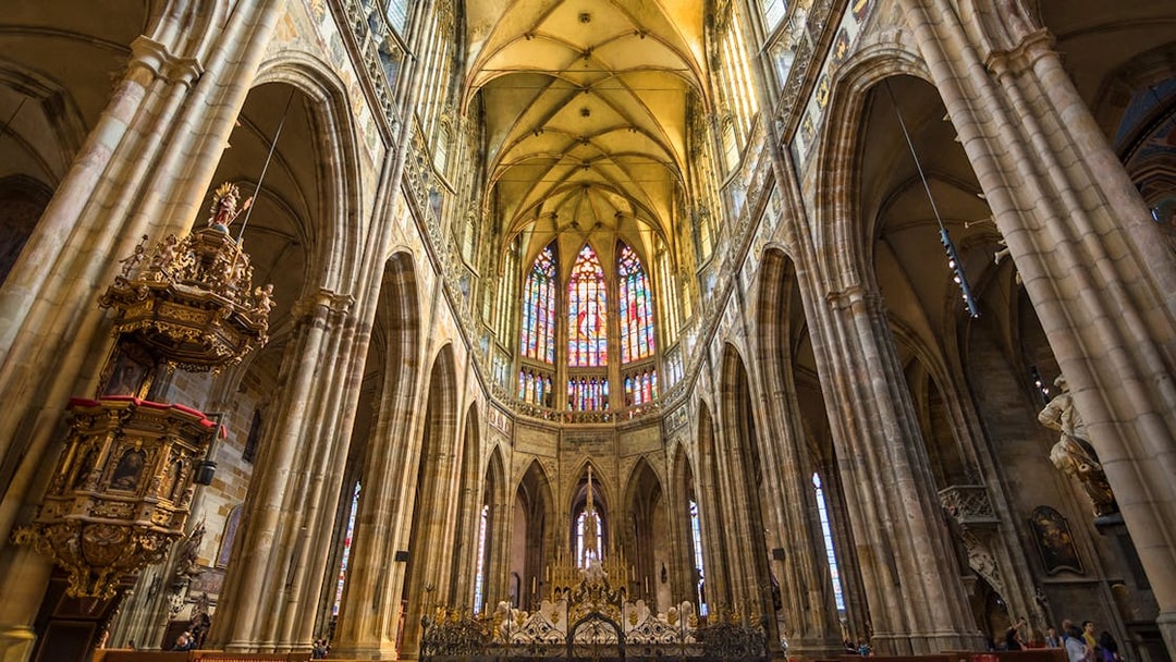 Stained glass windows and vaulted ceiling inside St Vitus Cathedral, Prague Castle.