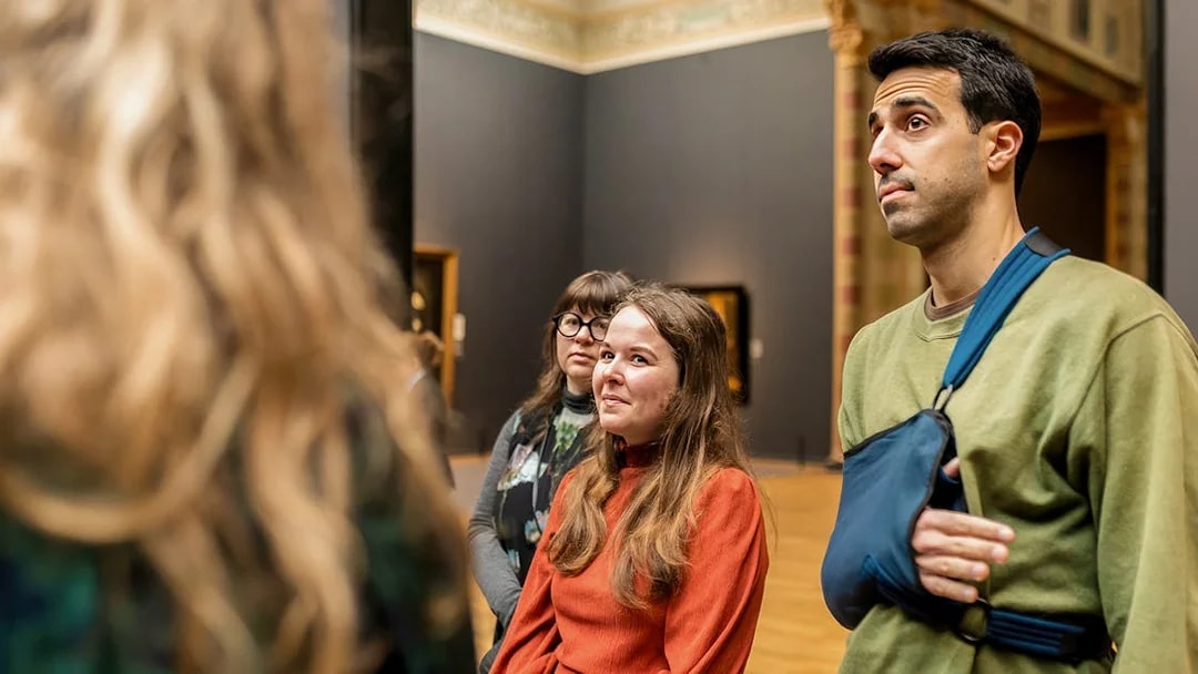 Visitors on a guided tour inside the Rijksmuseum, Amsterdam.