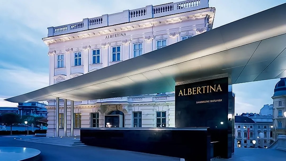 Albertina Museum entrance in Vienna at dusk.
