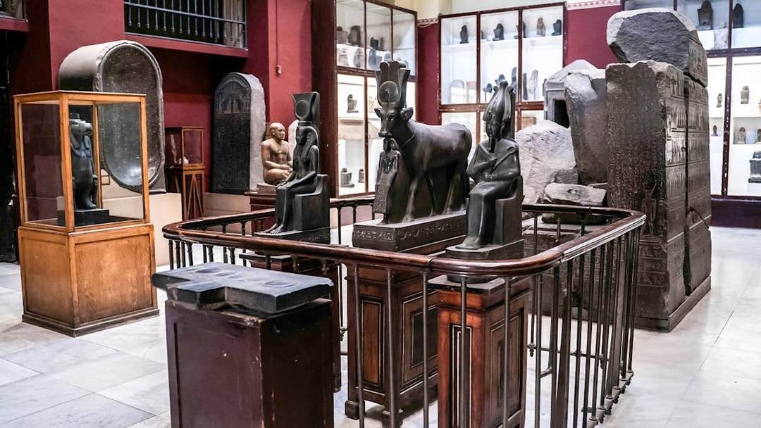 Ancient Egyptian statues and artefacts displayed in the Grand Egyptian Museum.