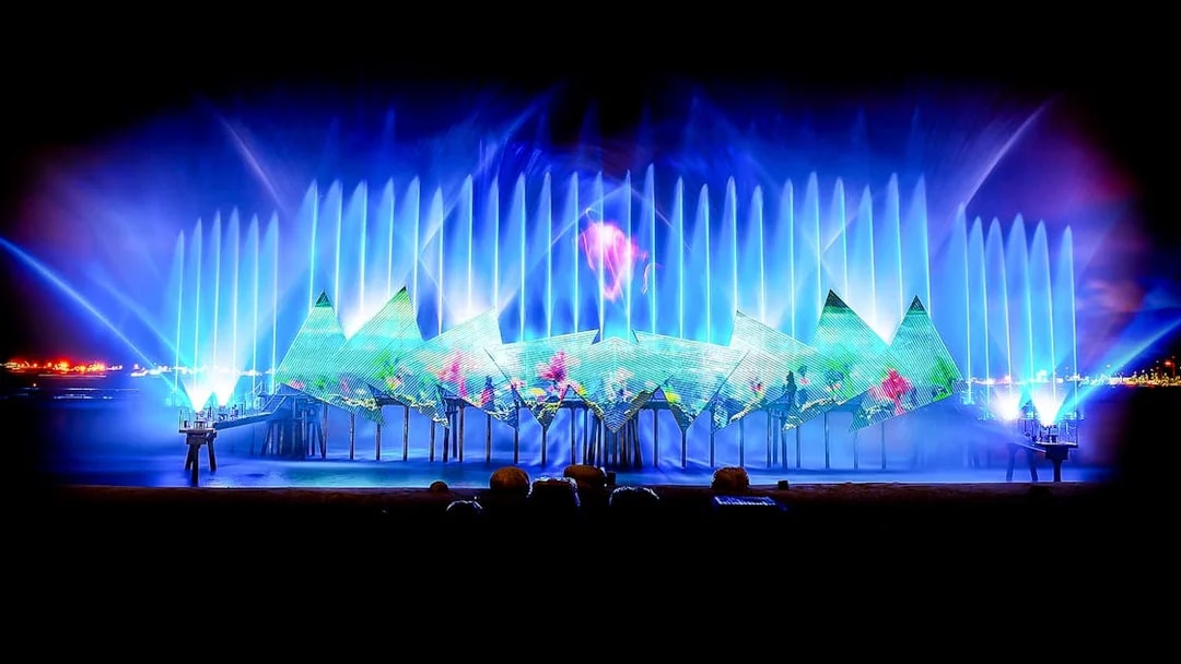 Wings of Time light and water show at Sentosa, Singapore, with vibrant projections.