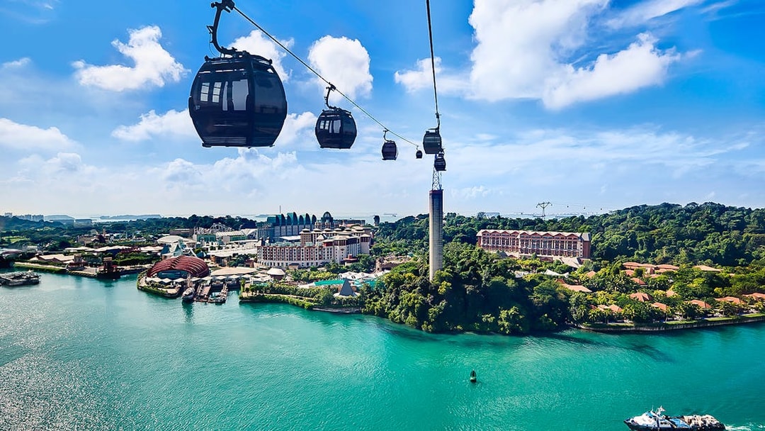 Singapore Cable Car over Sentosa Island with scenic view of the coastline and attractions.