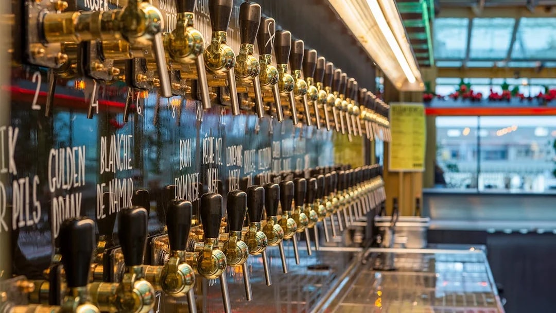 Beer taps lined up for tasting at a Brussels brewery.