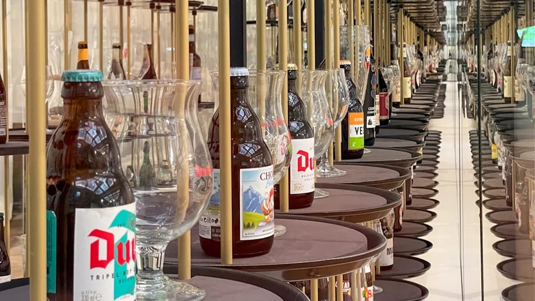 Belgian beer bottles and glasses displayed at Belgian Beer World, Brussels.