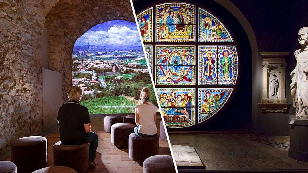 Visitors viewing Siena landscape and stained glass art in Val D'Orcia exhibit.