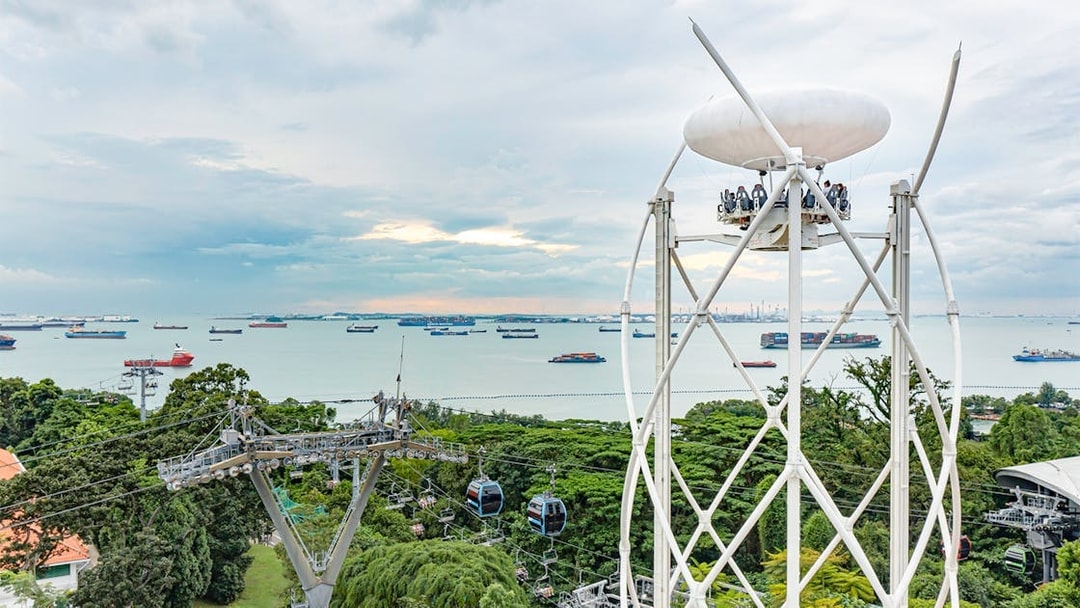 SkyHelix Sentosa ride with panoramic views of Singapore's coastline and cable cars.