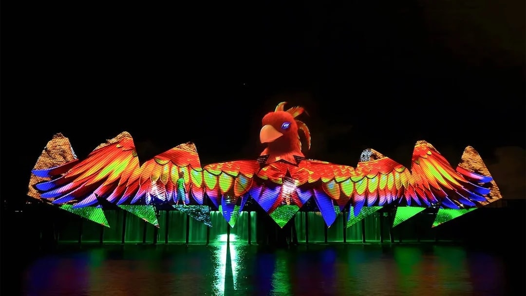 Wings of Time night show with colorful lights at Sentosa Island.