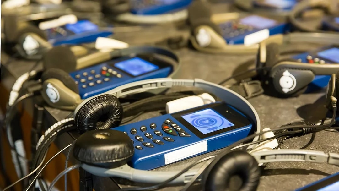 Audio guides and headphones for Amsterdam evening guided cruise.