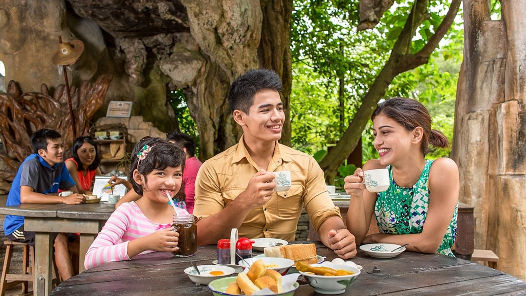 Family enjoying breakfast at Sunway Lost World of Tambun, Malaysia.