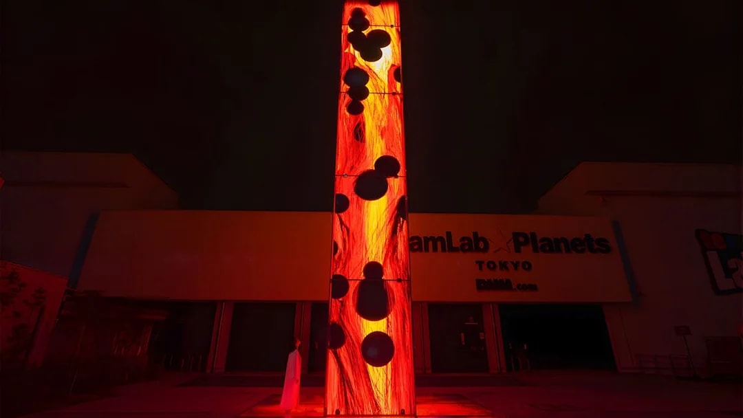 Entrance to teamLab Planets Tokyo with illuminated art installation.