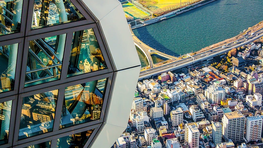 View from Tokyo Skytree overlooking cityscape and river.