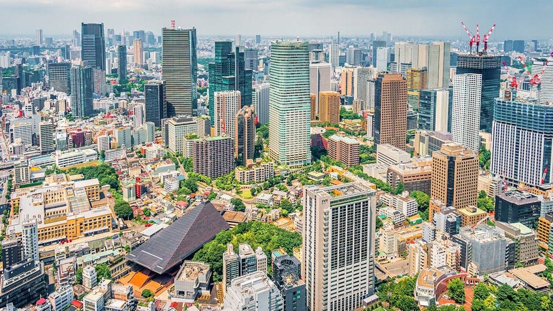 Tokyo cityscape from Tokyo Tower, showcasing skyscrapers and urban landscape.